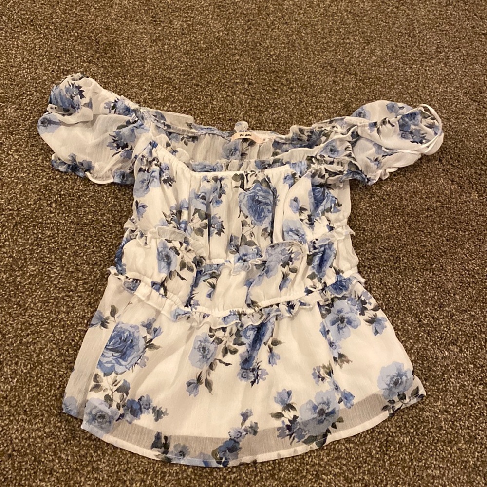 White shirt with blue flowers. Never wore cause it didn’t fit